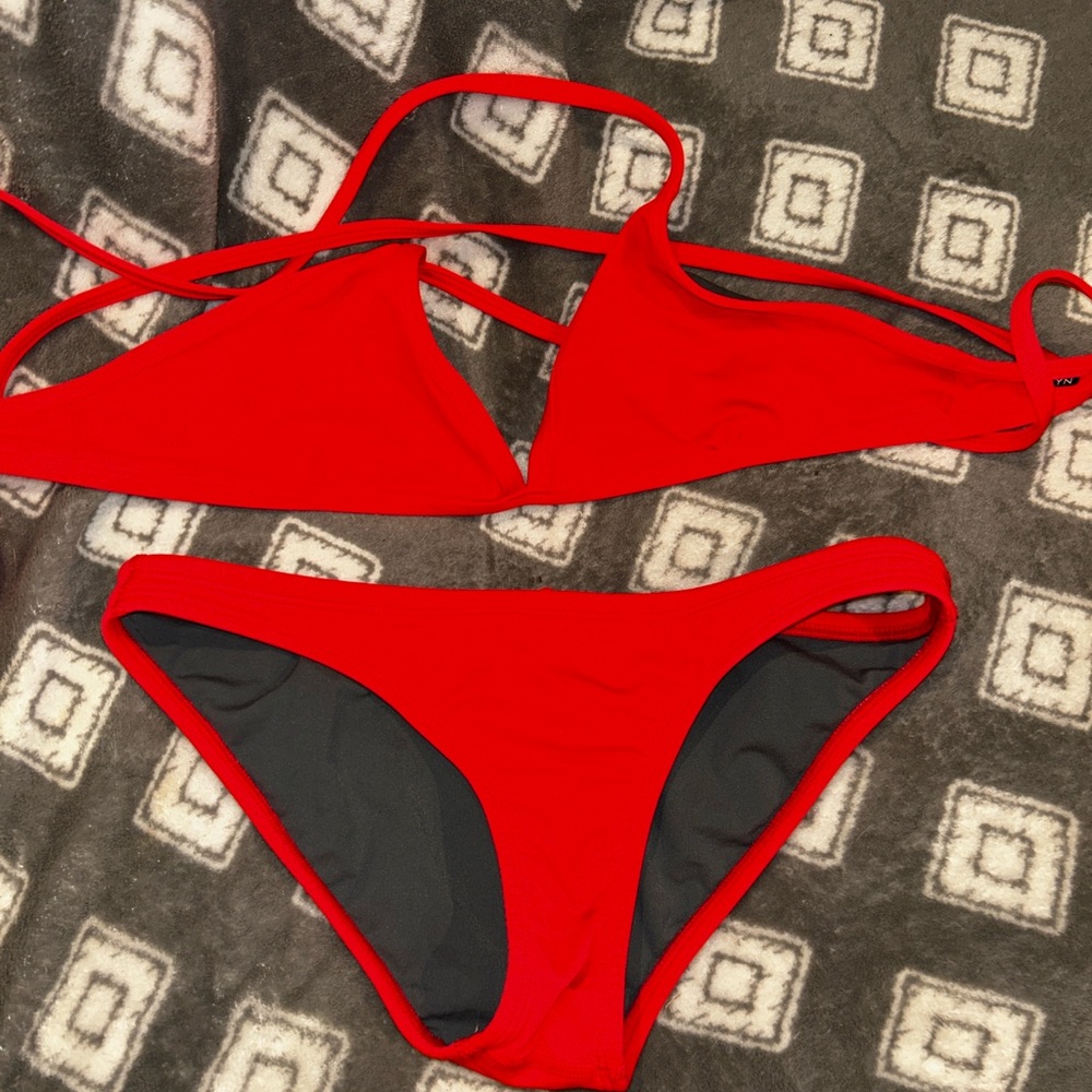 Joyln Bikini It is coral pink and NOT RED.  Large top, Medium bottom.
